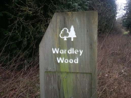 signpost showing woodland trust Wardley Wood